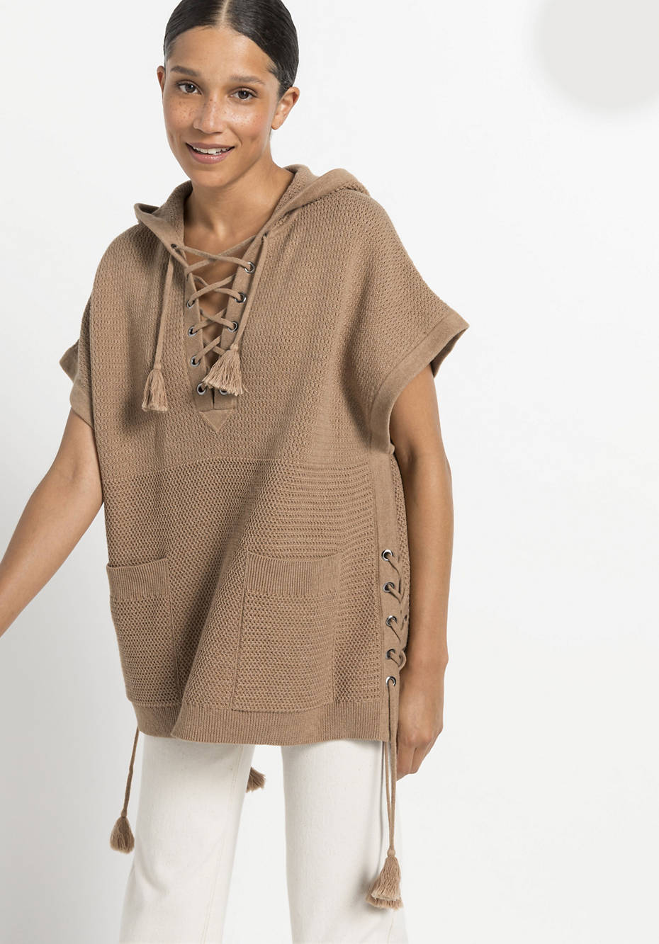 Knitted poncho made from pure organic cotton